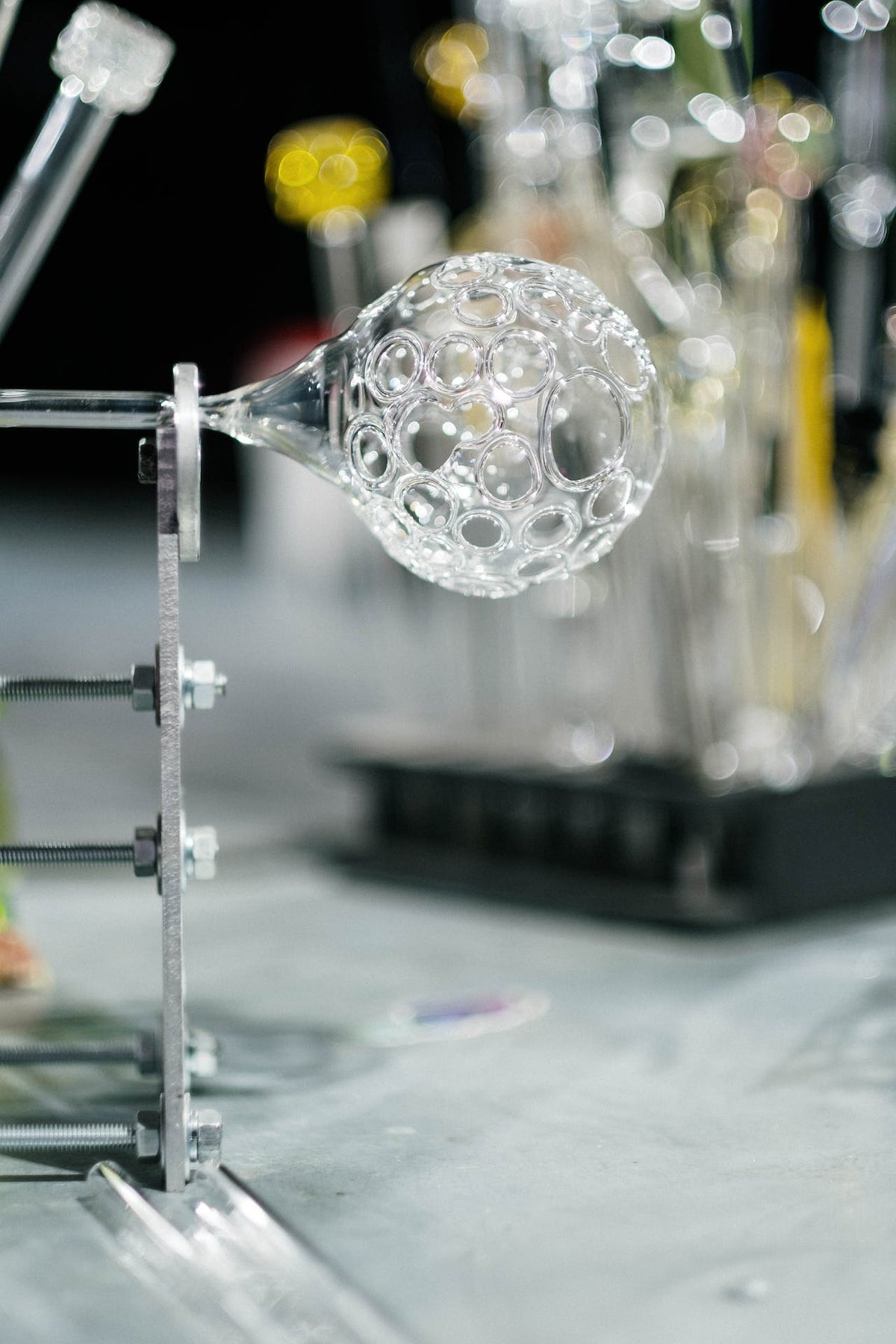 How are hand-painted glass baubles made?