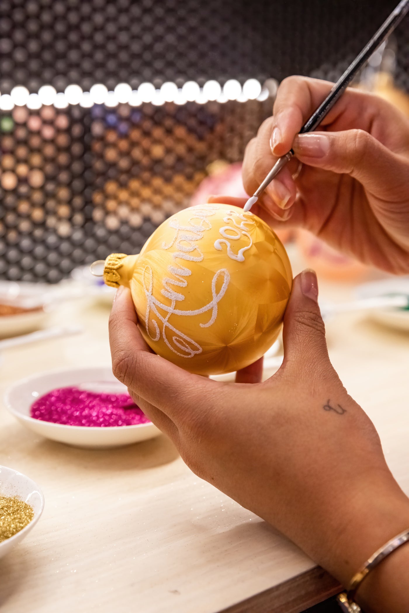 Hand-personalising an Artisan Ornaments bauble
