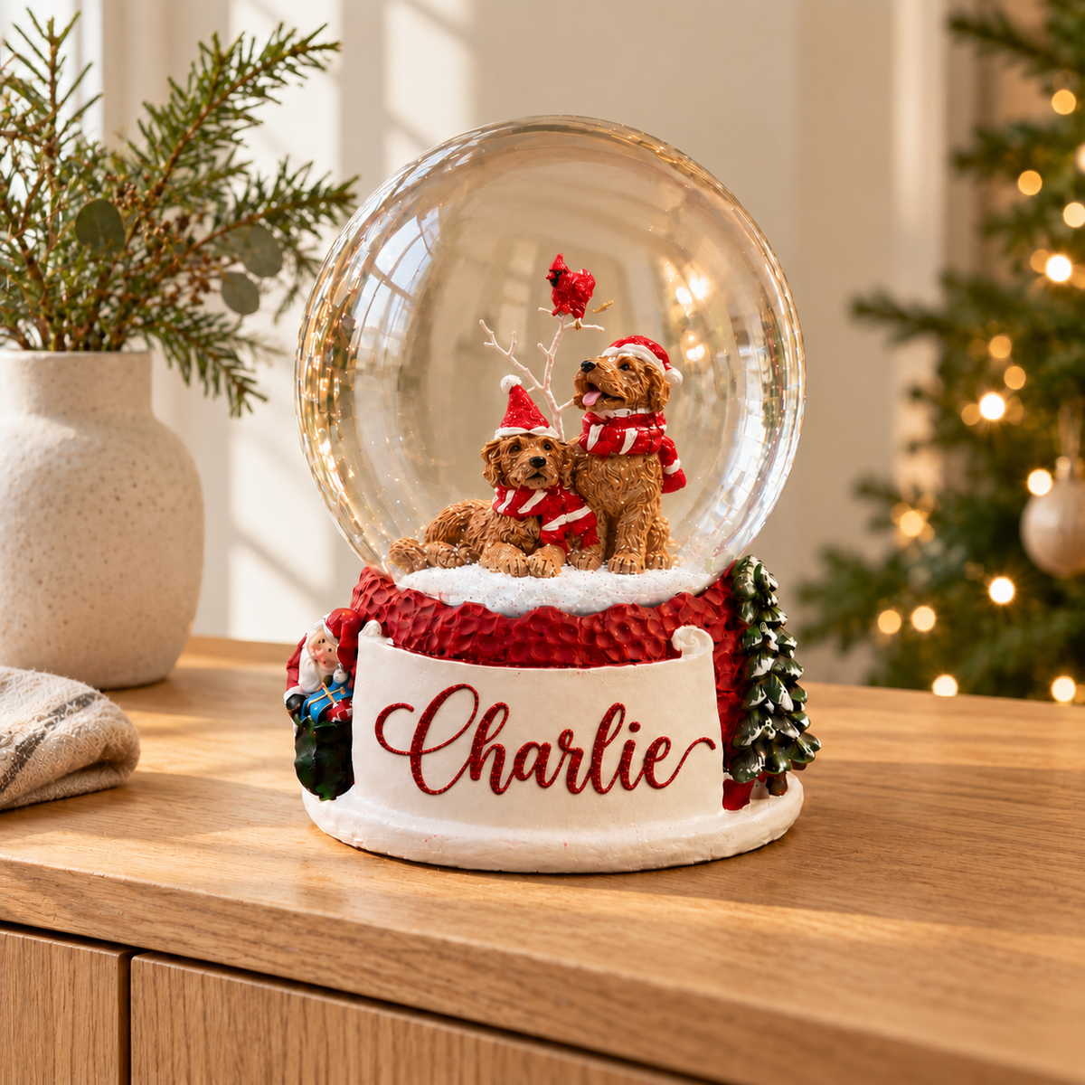 Festive Pups Snow Globe, styled on a wooden sideboard