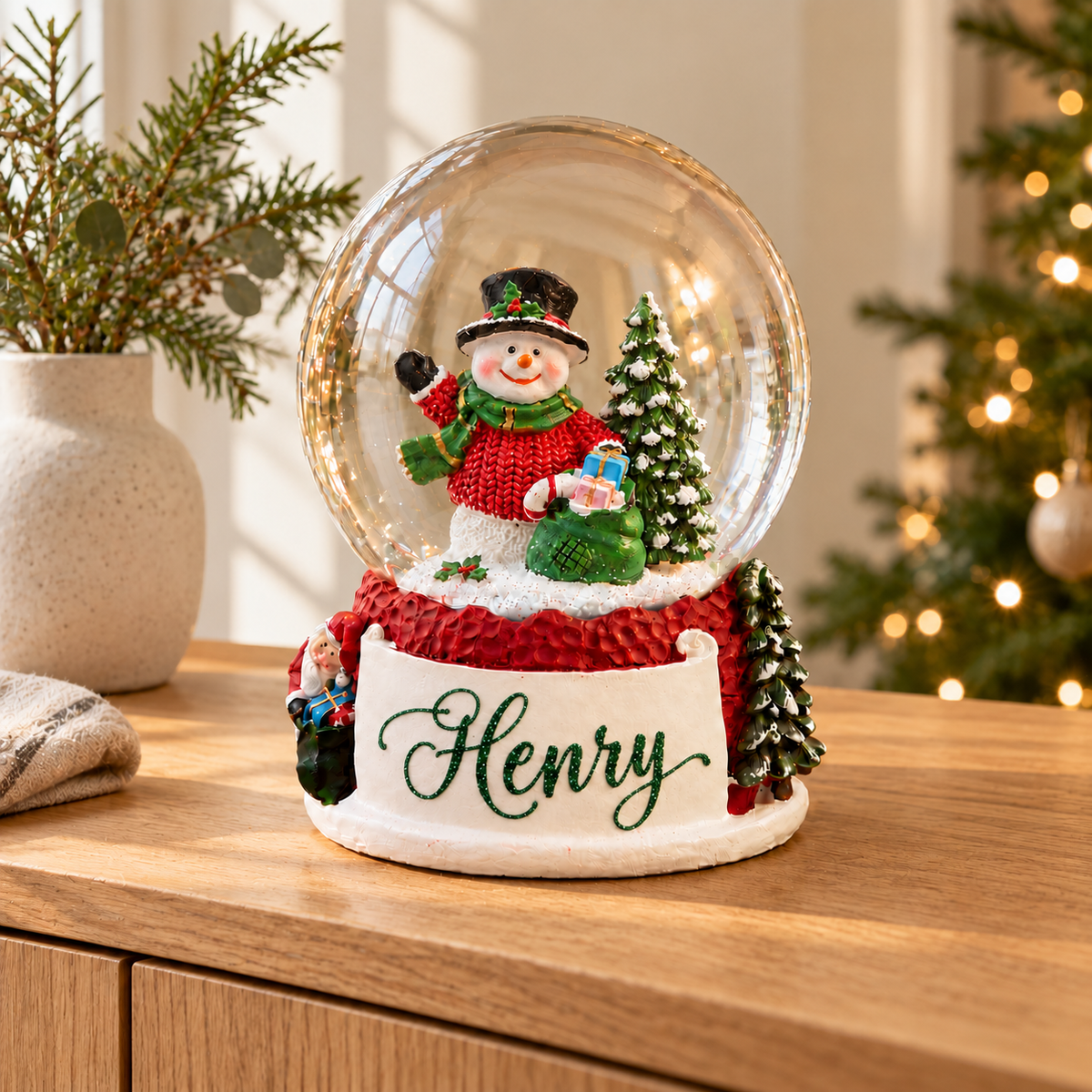 Snowman Snow Globe, styled on a wooden sideboard
